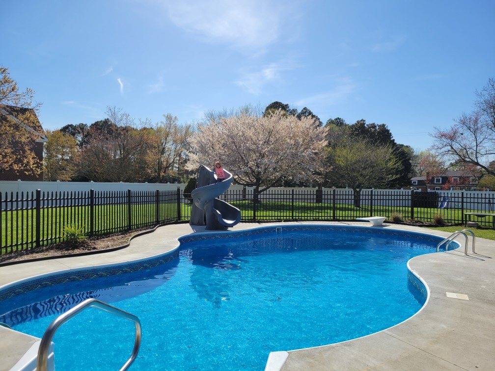 Pool with sliding board